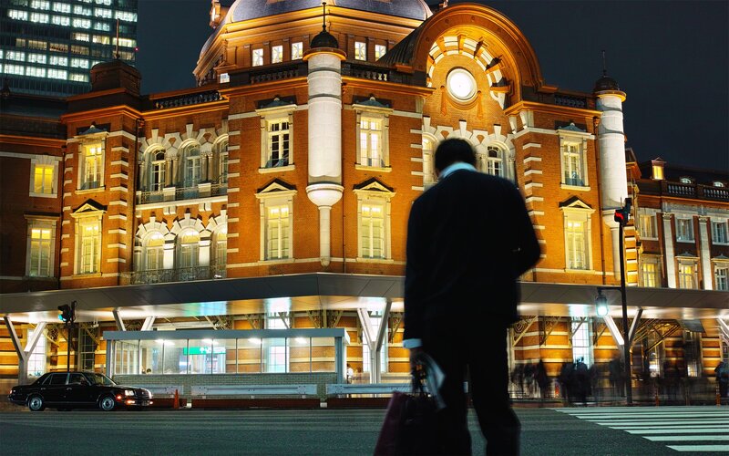 Man walking near Tokyo Station at night