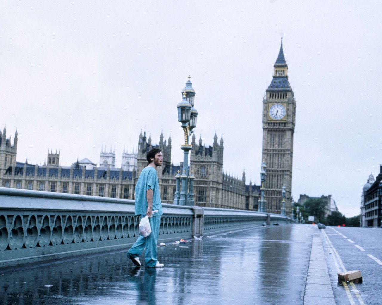 Man walking on bridge in London