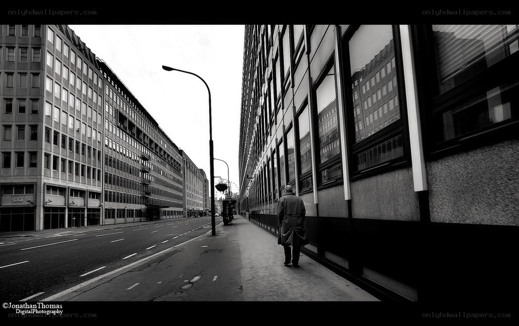 Man walking on city sidewalk