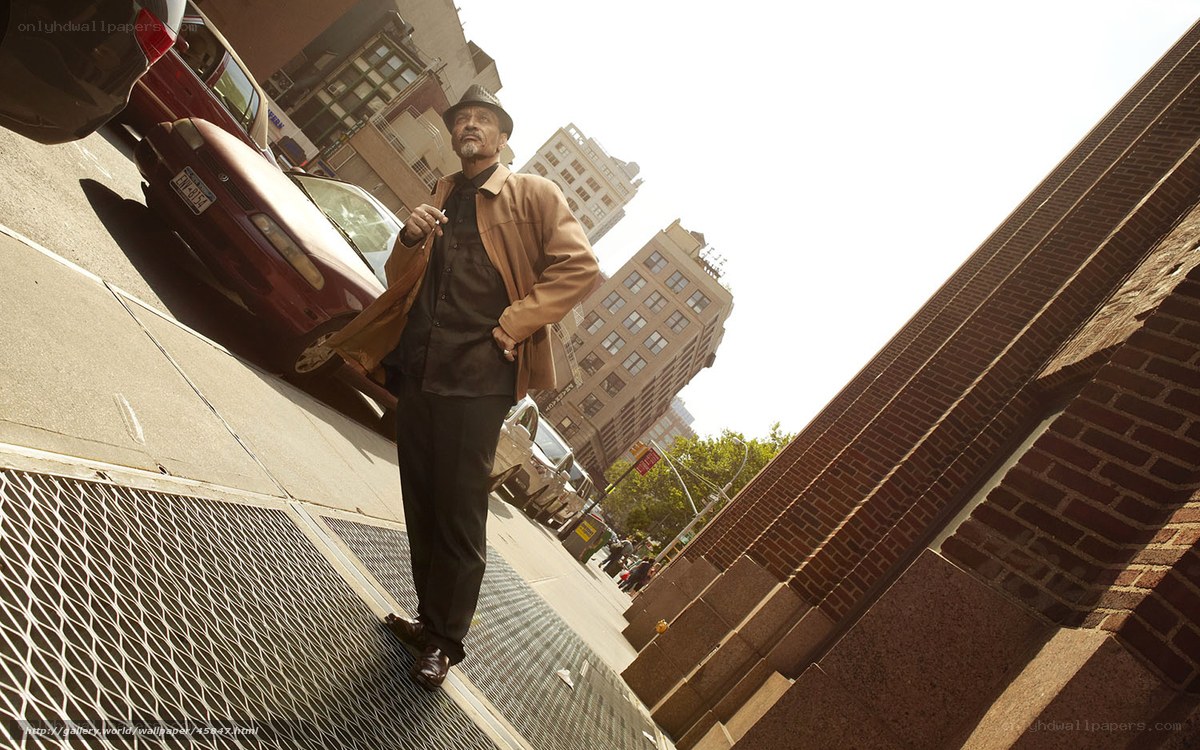 Man walking on city sidewalk