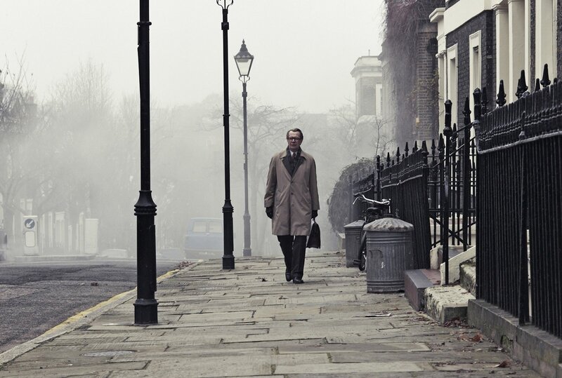 man walking on foggy street