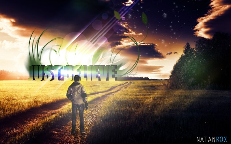 man walking on path at sunset