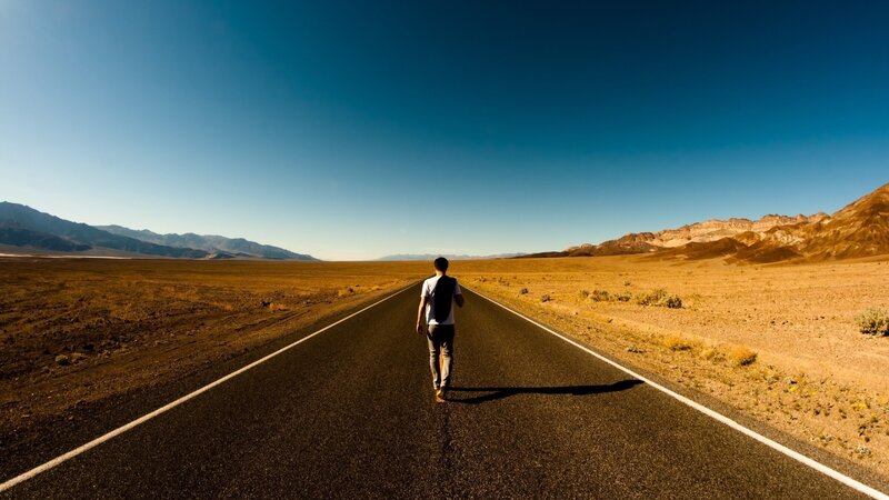 Man Walking on Road — Blue, Serene, Afternoon
