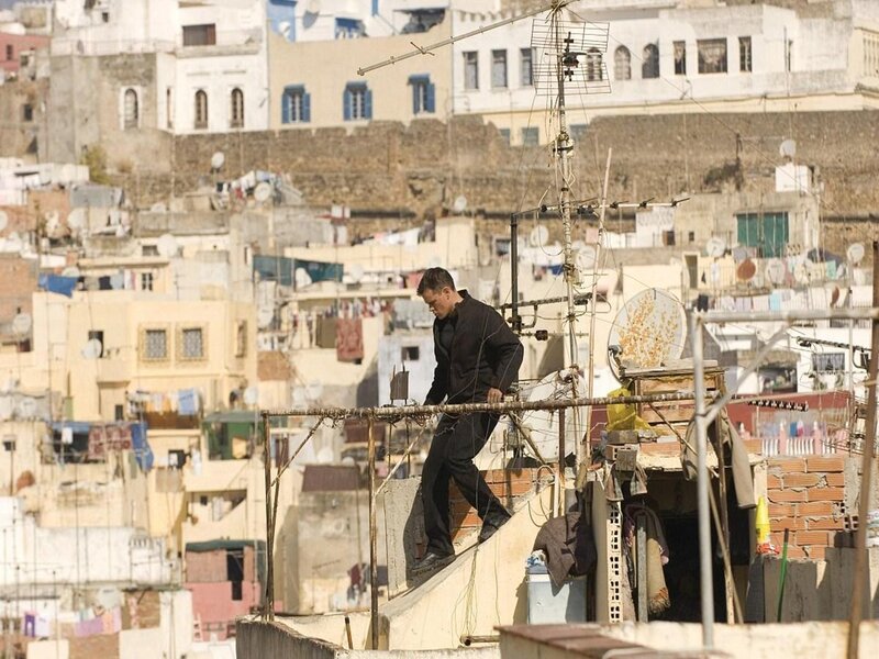 Man walking on rooftop in city