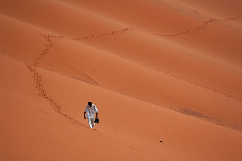 Man Walking on Sand Dune