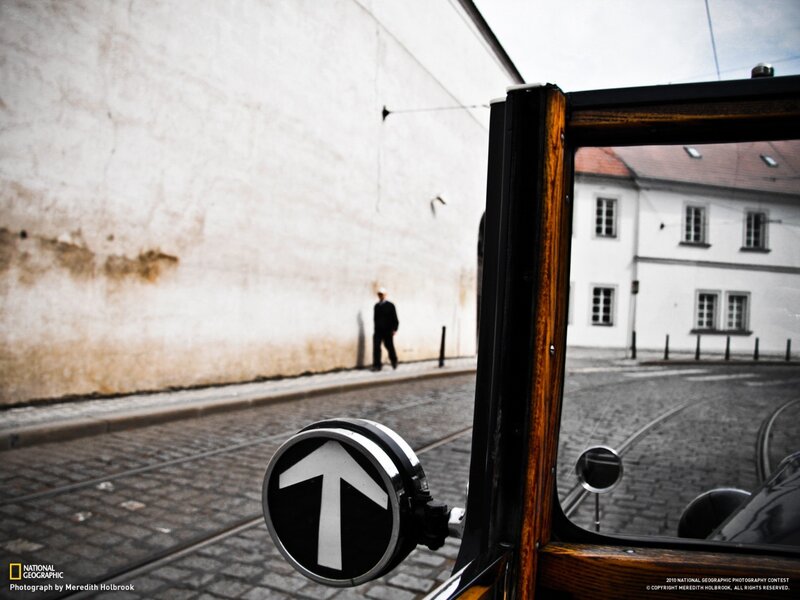 Man Walking on Street — Black, Dramatic, Photograph, Building
