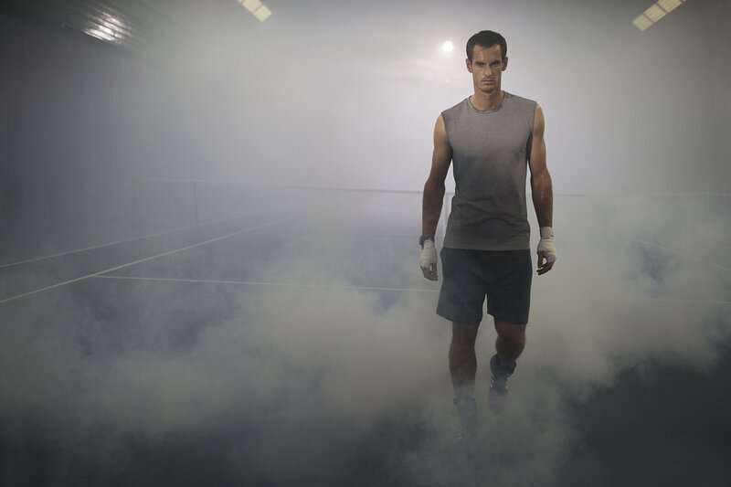 Man Walking on Tennis Court