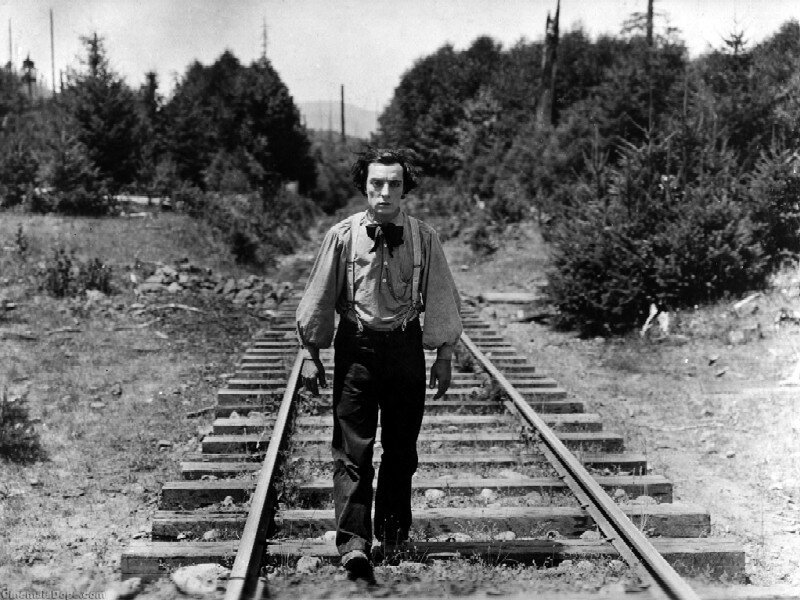 Man Walking on Train Tracks — Black