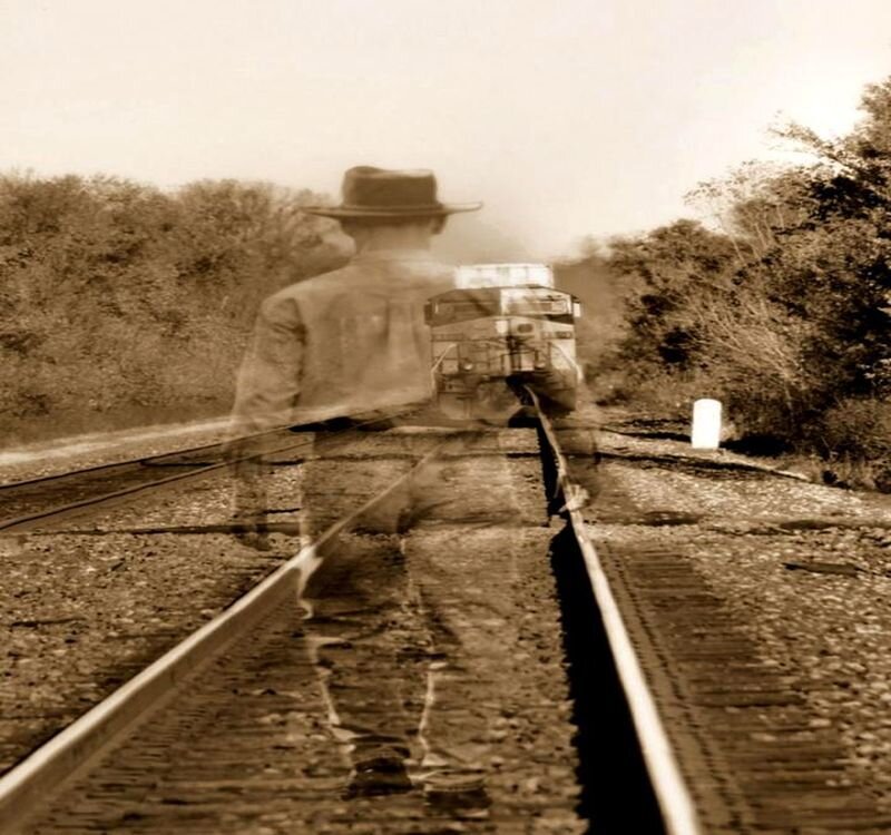 Man Walking on Train Tracks