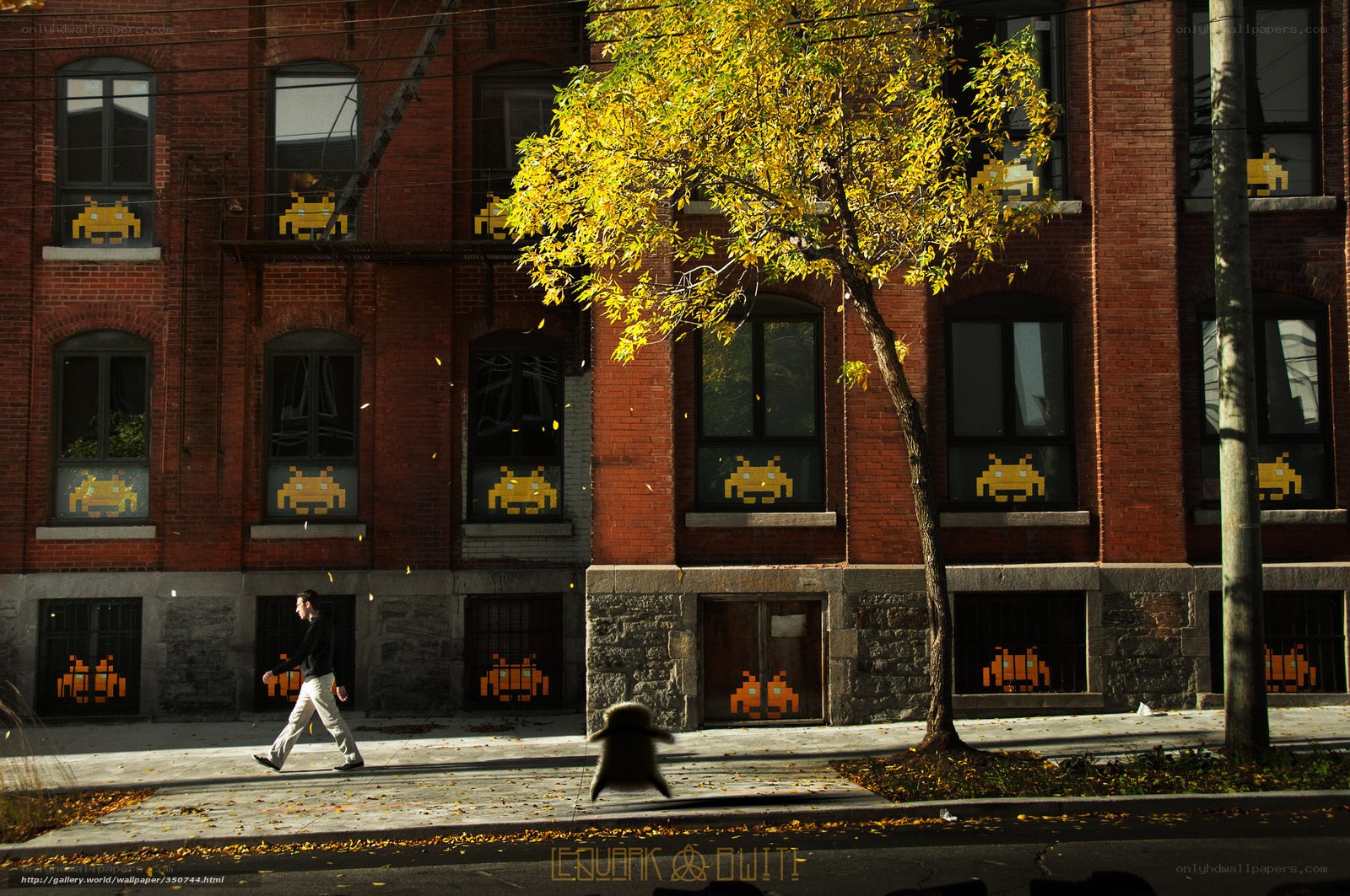 Man walking past alien-themed building