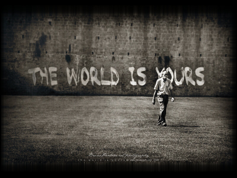 man walking past graffiti