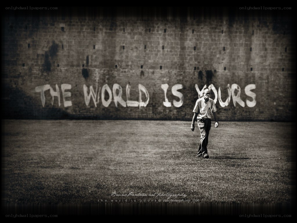 man walking past graffiti