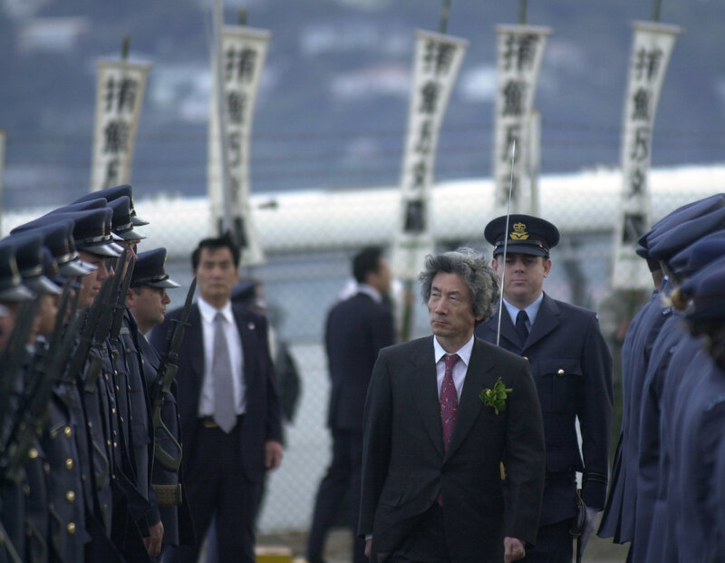 Man walking past military honor guard