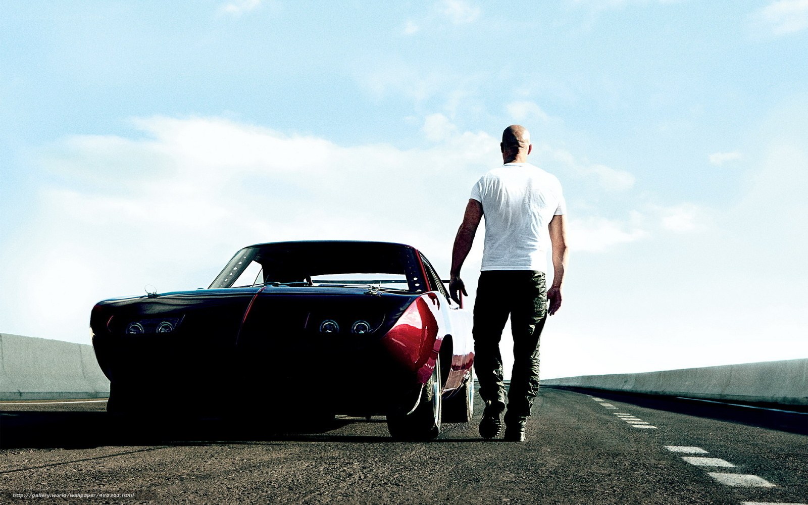 man walking with muscle car