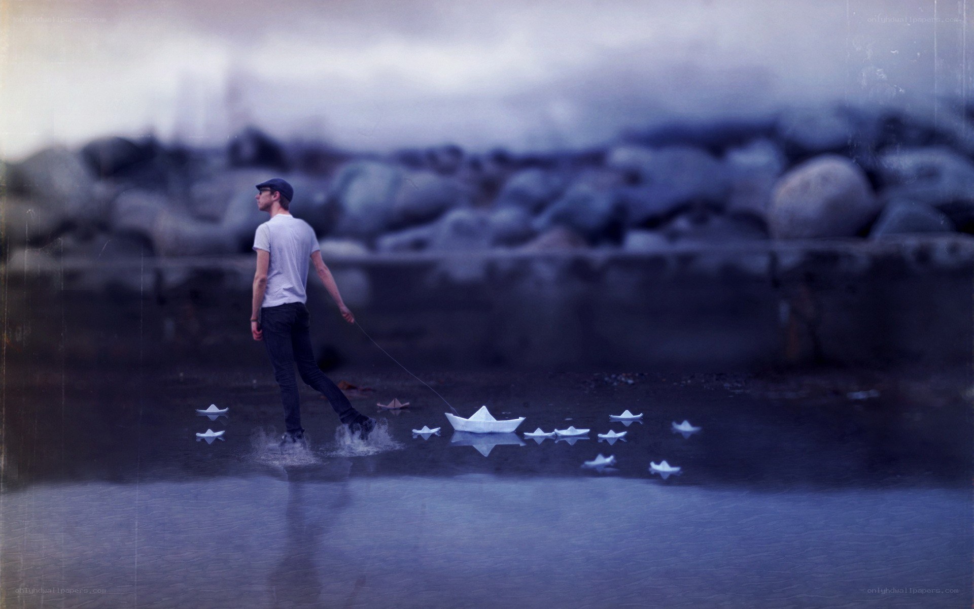 man walking with paper boats