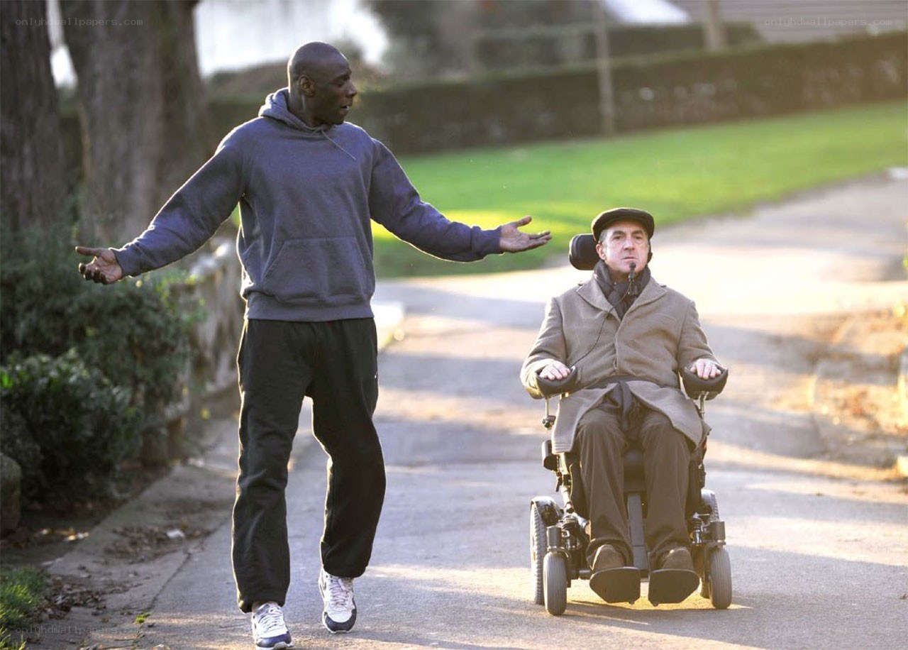 Man walking with wheelchair user
