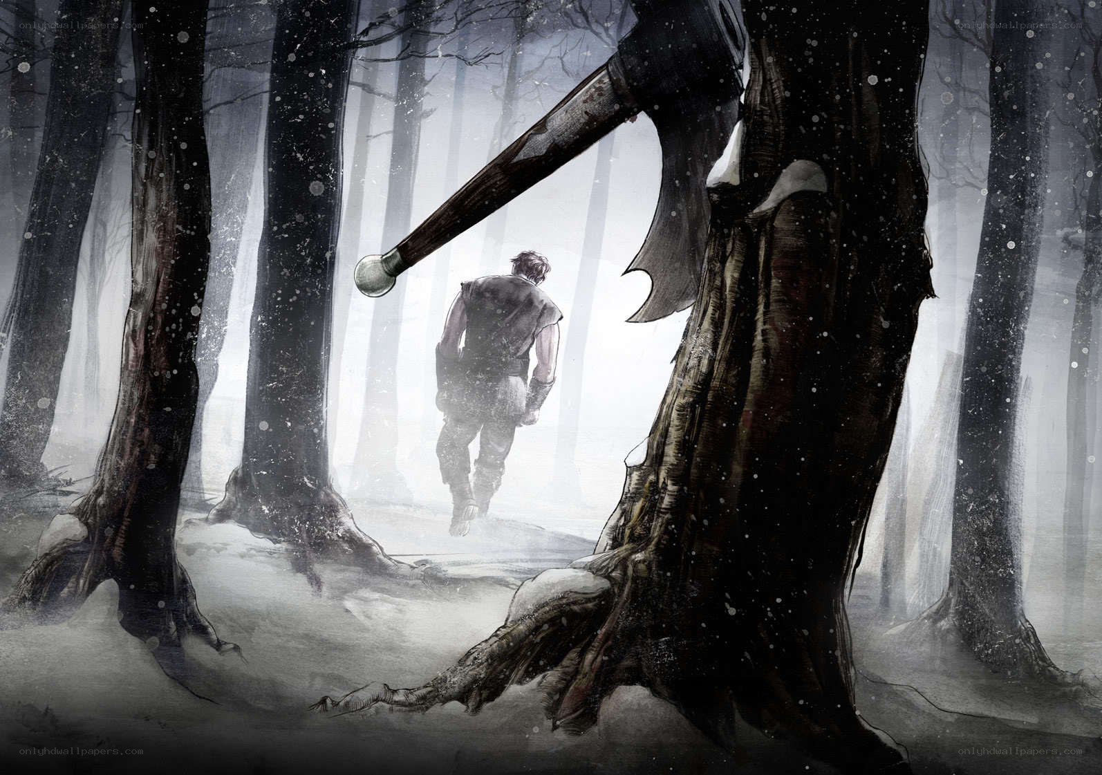 Man walks through snowy forest