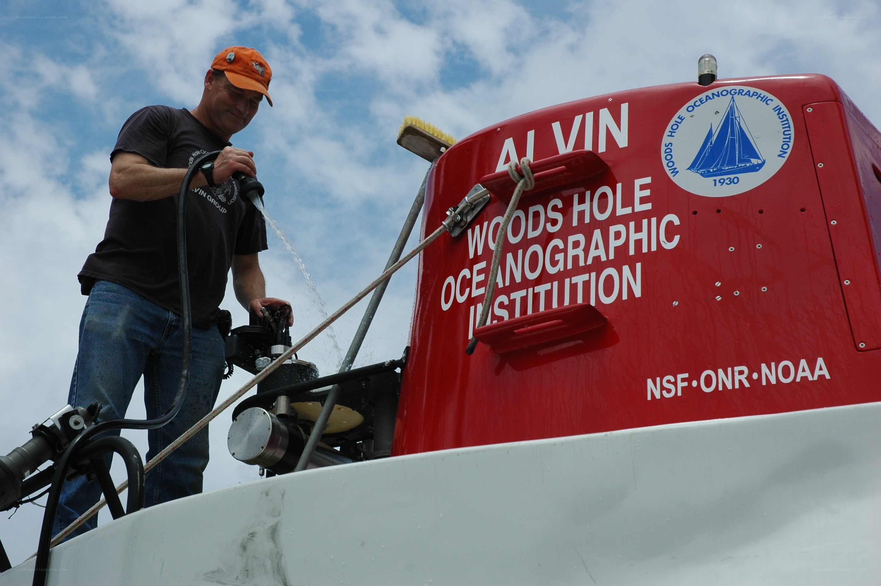 Man washing a research vessel