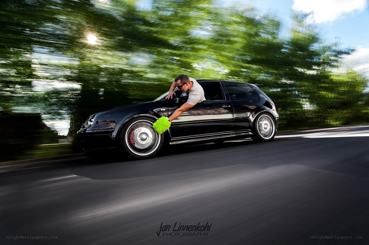 Man washing car in motion
