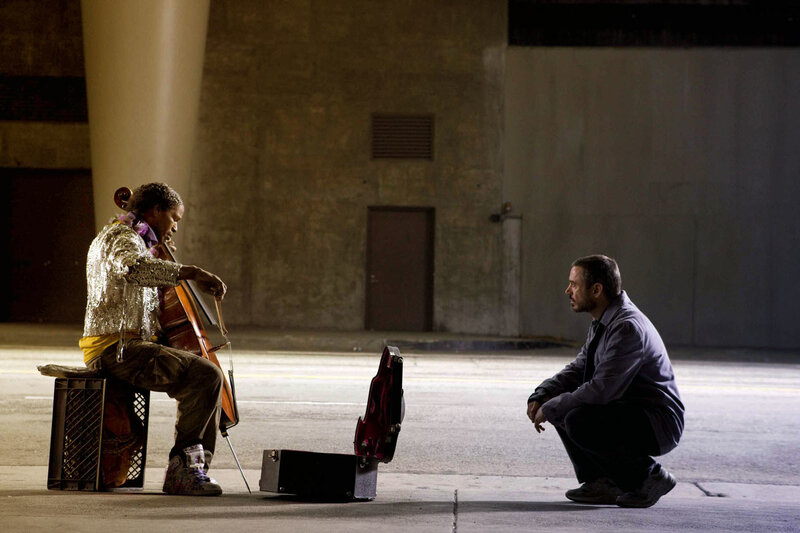 Man watching cello player
