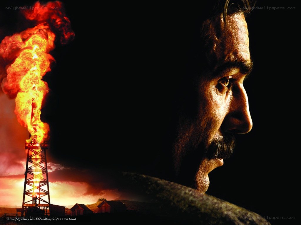 Man watching oil fire