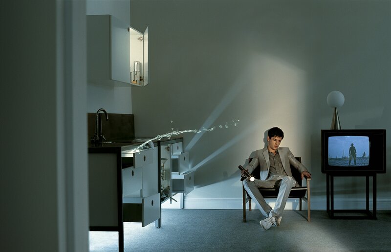 Man watching TV in modern room