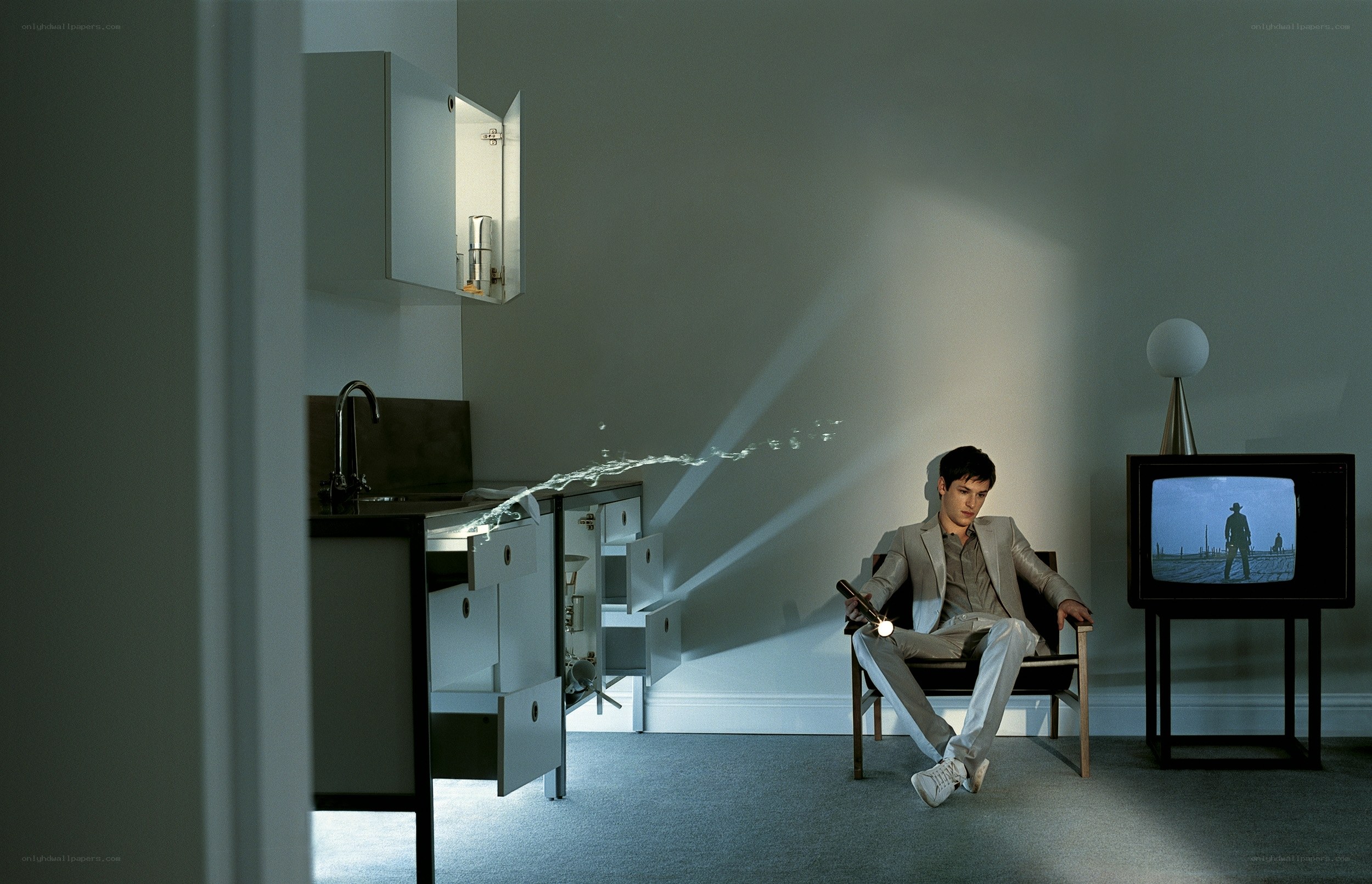 Man watching TV in modern room