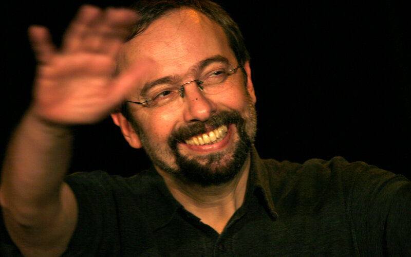 man waving at camera
