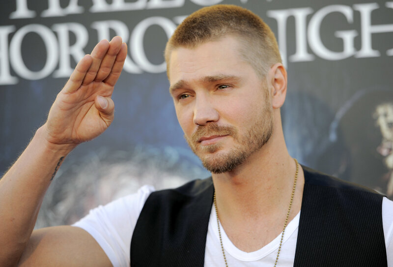 man waving at event