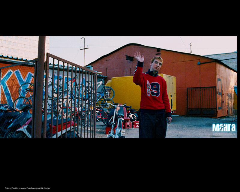 Man waving in urban alley