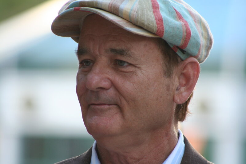 man wearing a striped cap