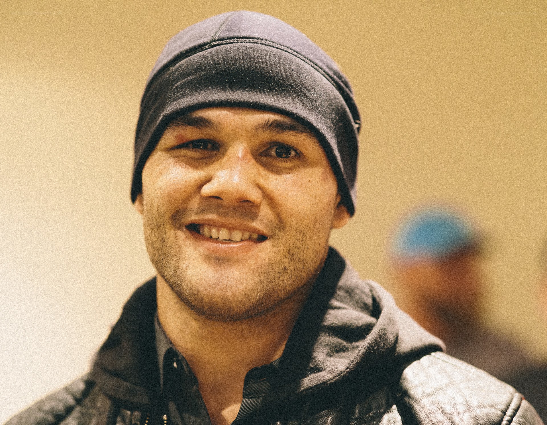 man wearing beanie smiling