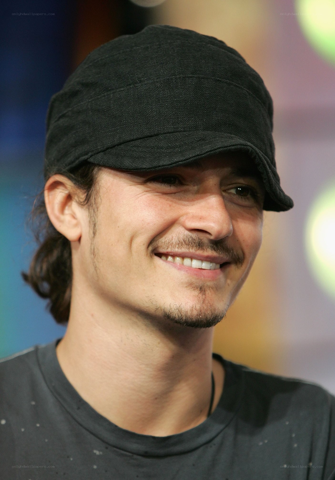 man wearing black cap smiling