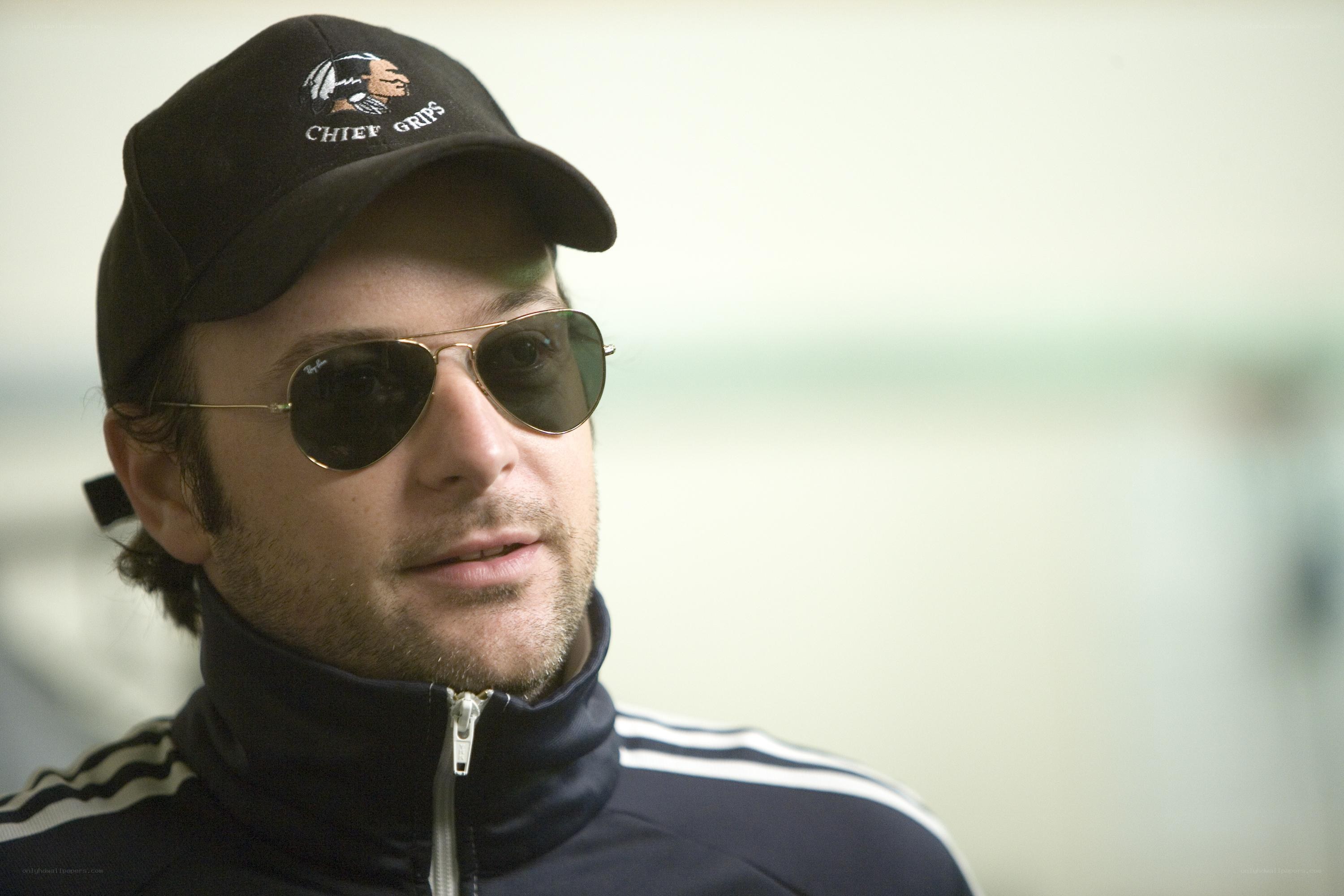 man wearing cap and sunglasses