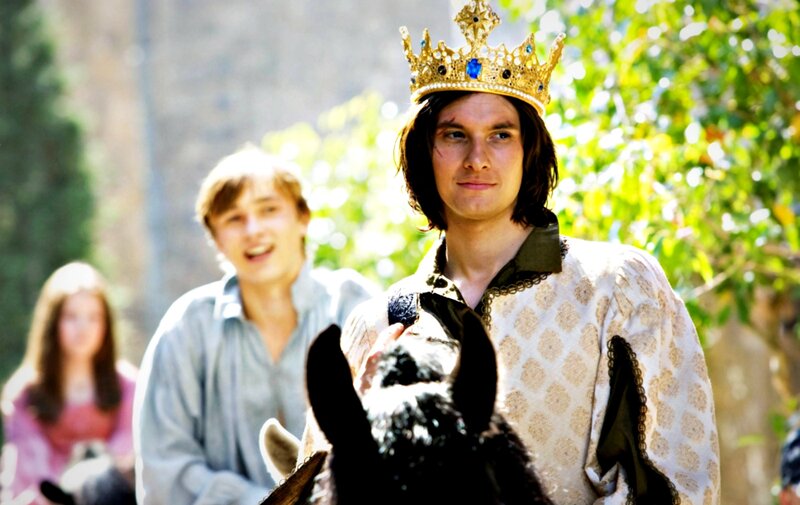 Man Wearing Crown on Horse