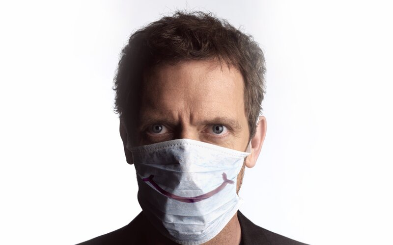 man wearing face mask with smile