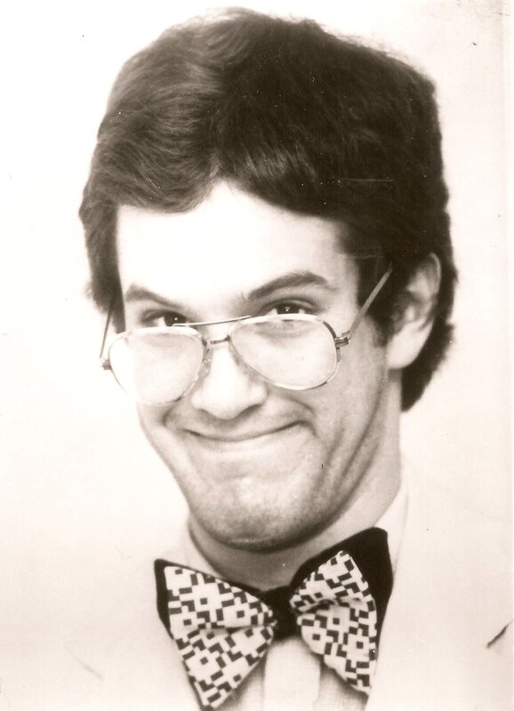 man wearing glasses and bow tie