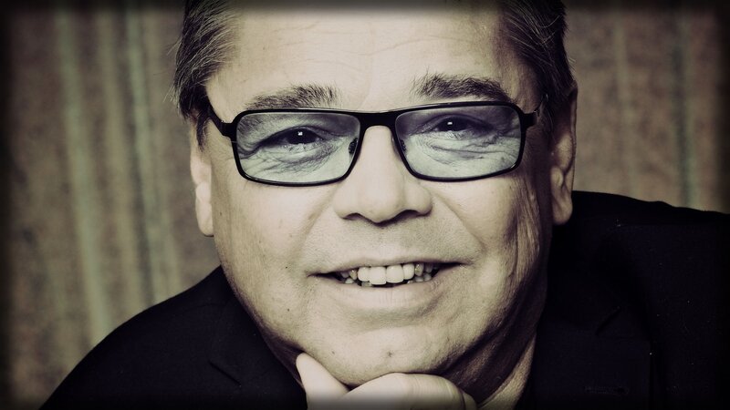 man wearing glasses smiling