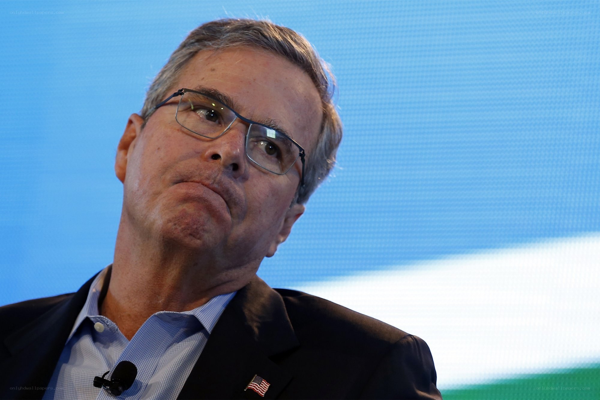 man wearing glasses speaking