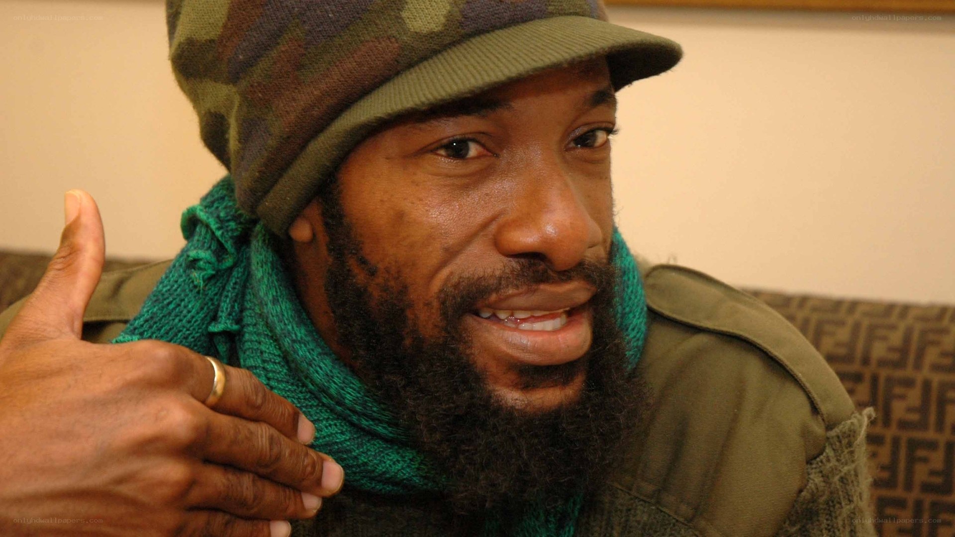 man wearing green hat and scarf