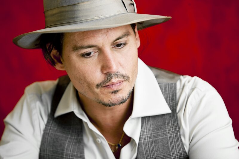 Man Wearing Hat and Vest