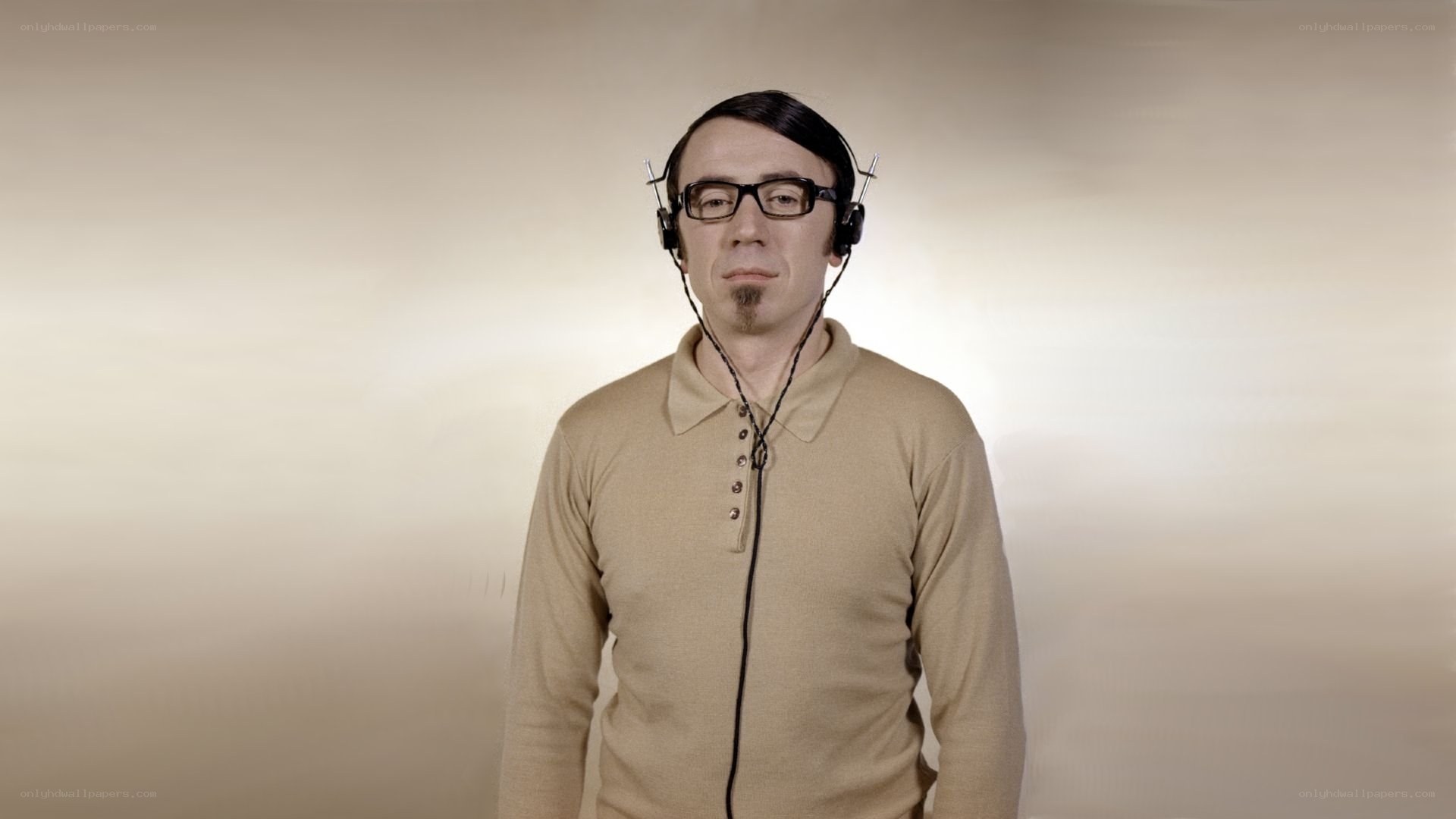 Man wearing headphones and glasses