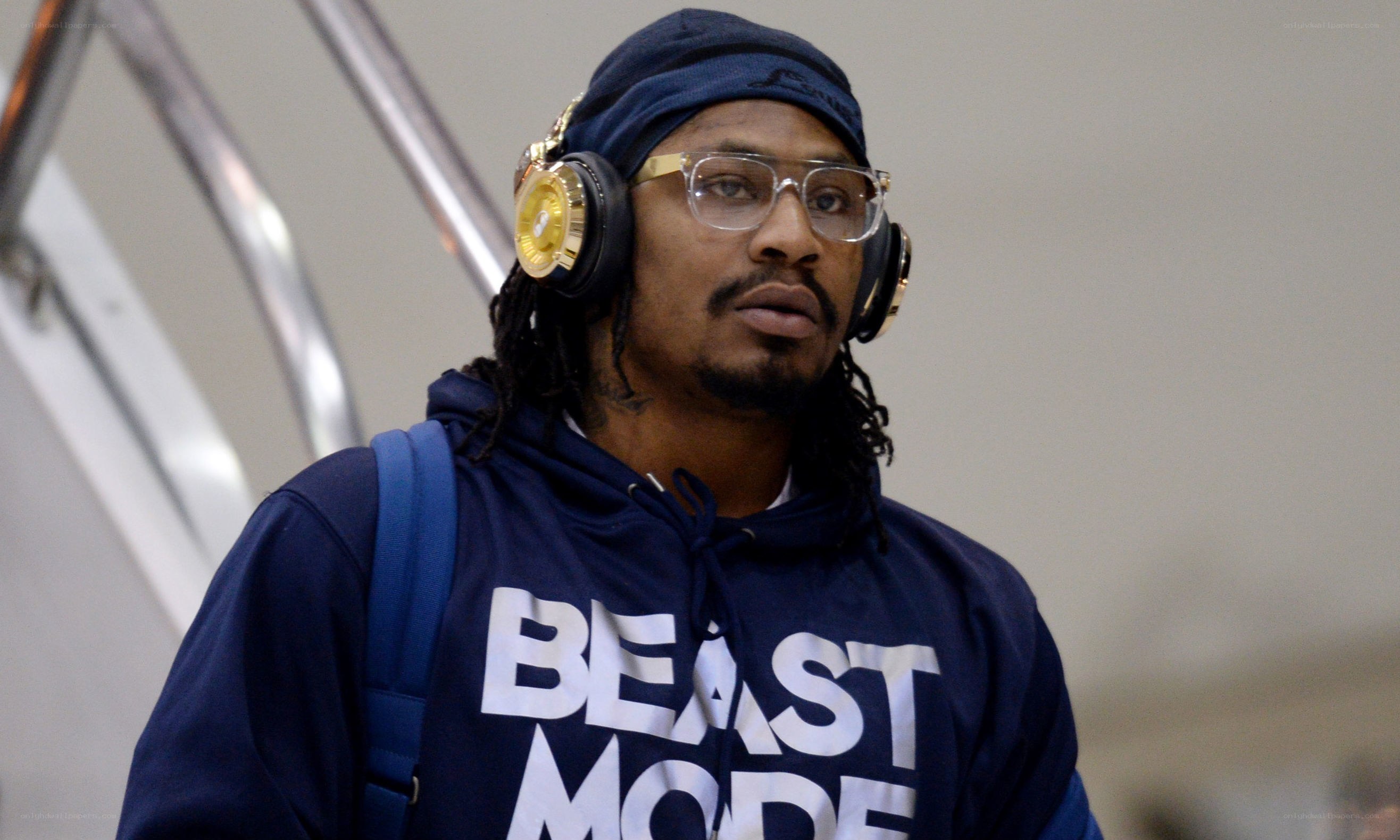 man wearing headphones and hoodie