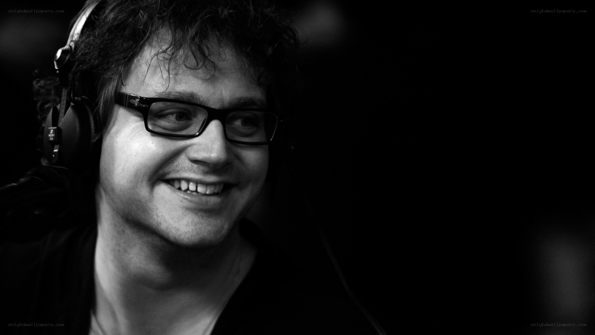 man wearing headphones smiling