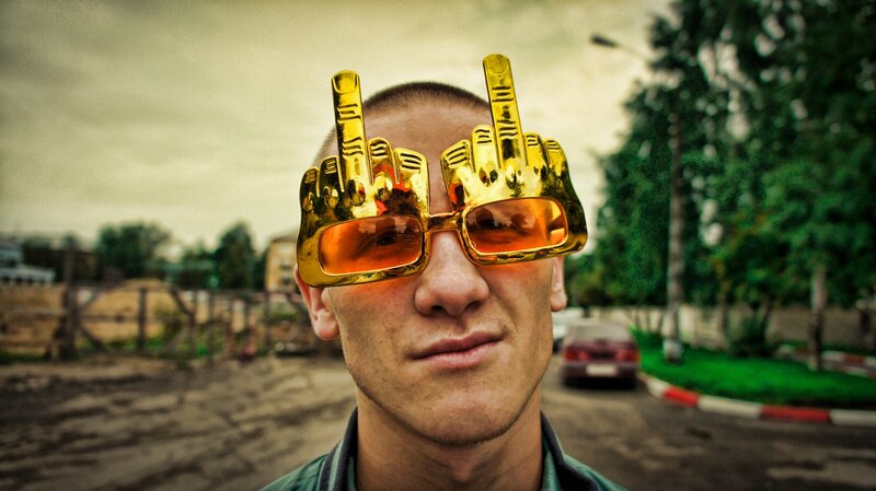 Man wearing novelty sunglasses