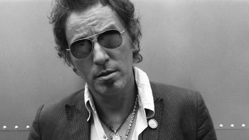man wearing sunglasses and a suit