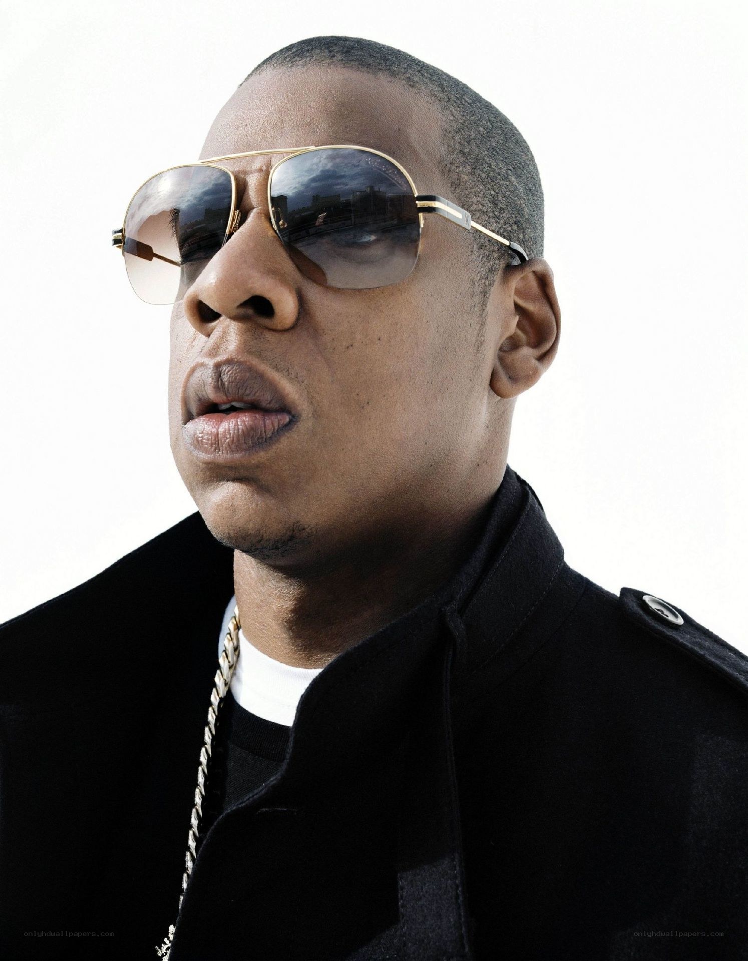 man wearing sunglasses and chain