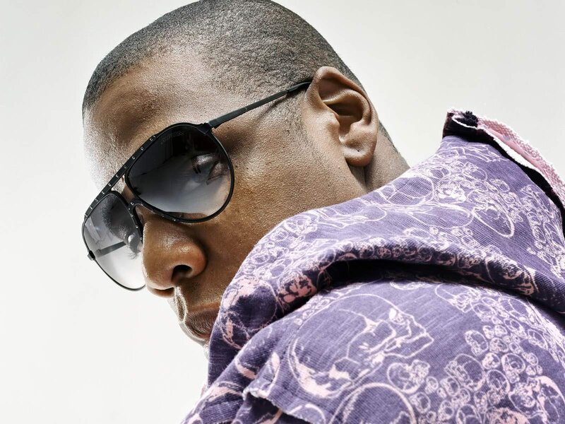 man wearing sunglasses and patterned hoodie
