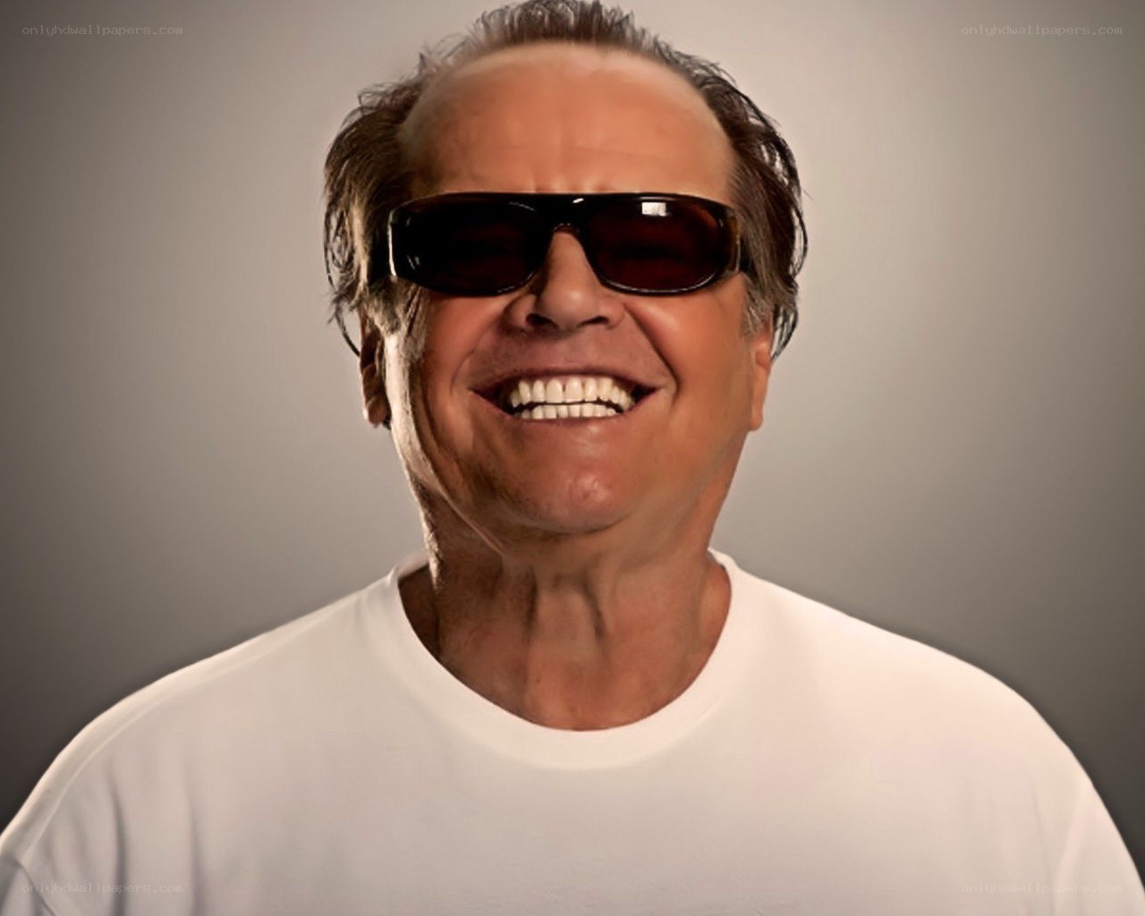 man wearing sunglasses smiling