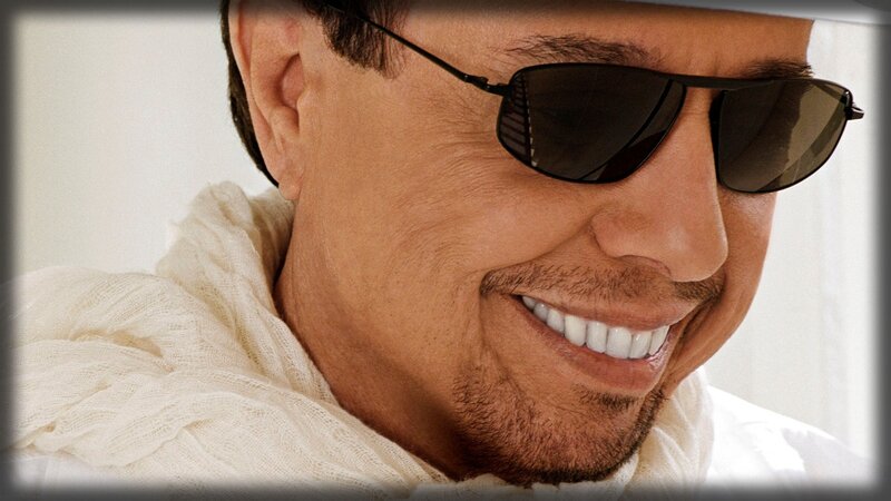 man wearing sunglasses smiling